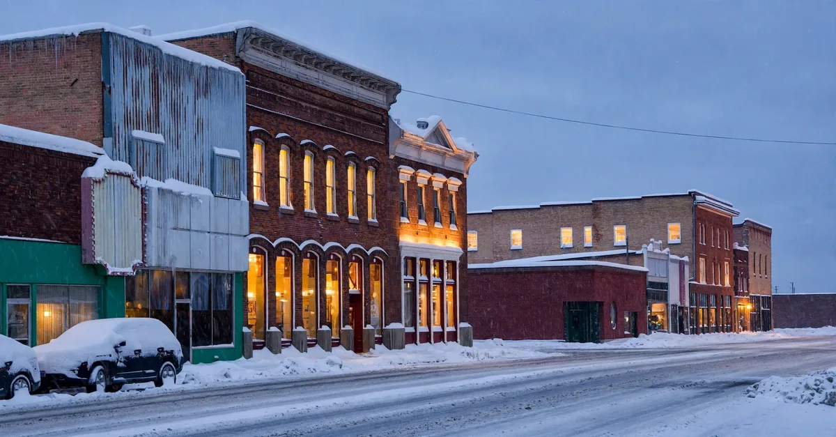 Historic downtown Evanston brick buildings in snow at dusk